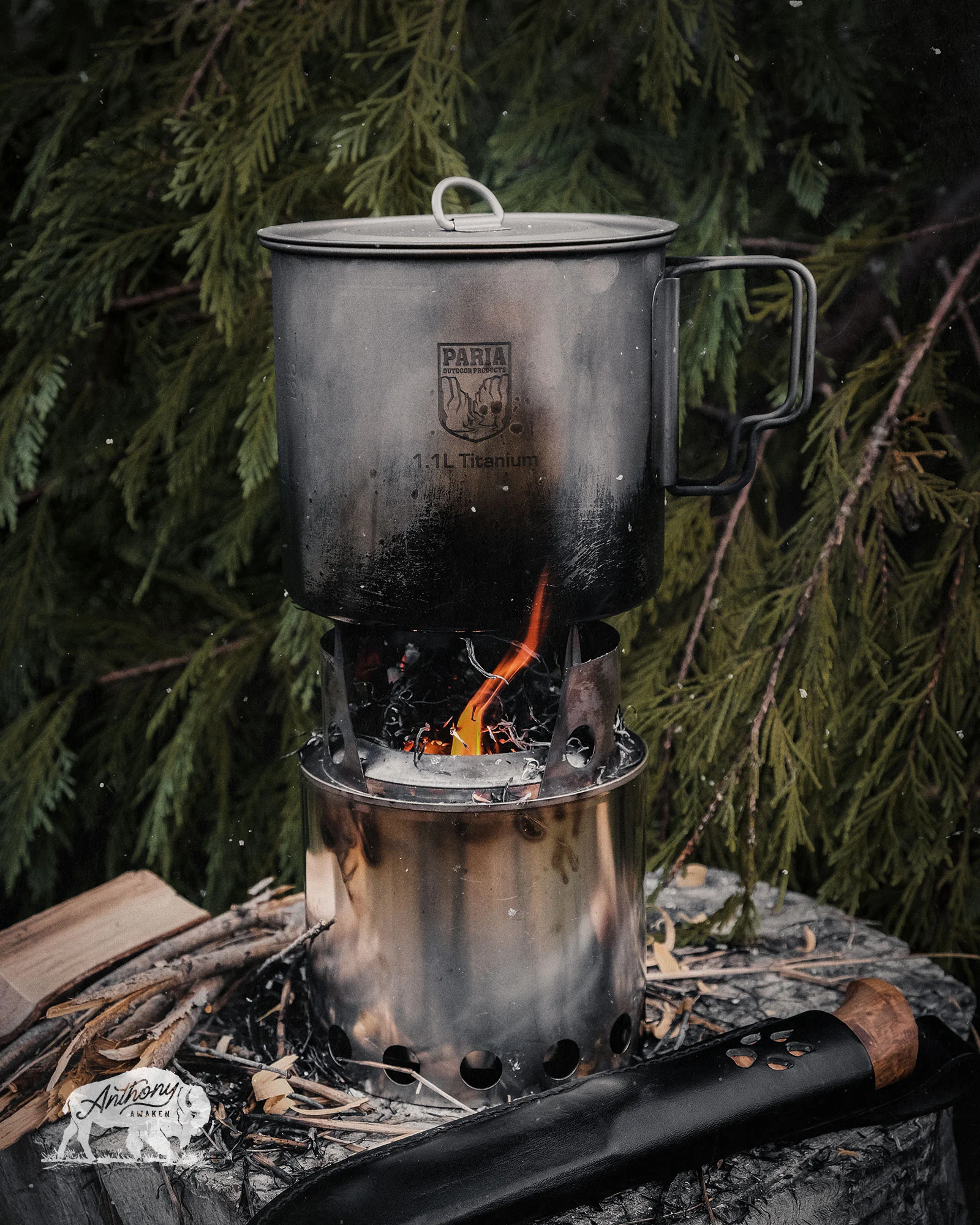 Well-used titanium camping pot after three years of outdoor use showing normal patina and wear patterns