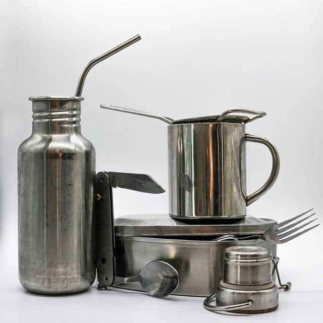 Stainless and titanium camping utensils being cleaned - mild soap and water is sufficient for titanium cutlery maintenance Stainless and titanium camping utensils being cleaned - mild soap and water is sufficient for titanium cutlery maintenance