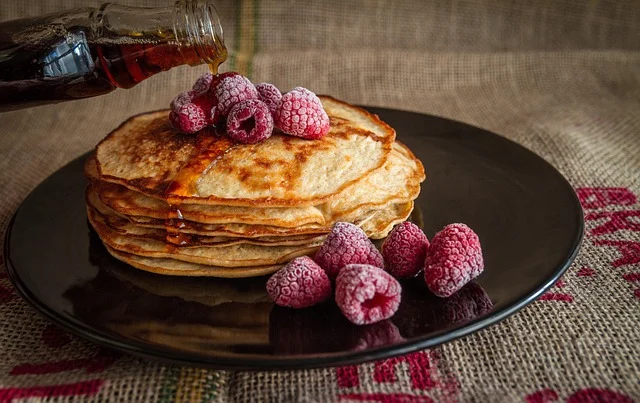 Pancakes cooking in a frying pan with oil - demonstrating proper heat and fat technique for titanium or stainless steel cookware Pancakes cooking in a frying pan with oil - demonstrating proper heat and fat technique for titanium or stainless steel cookware