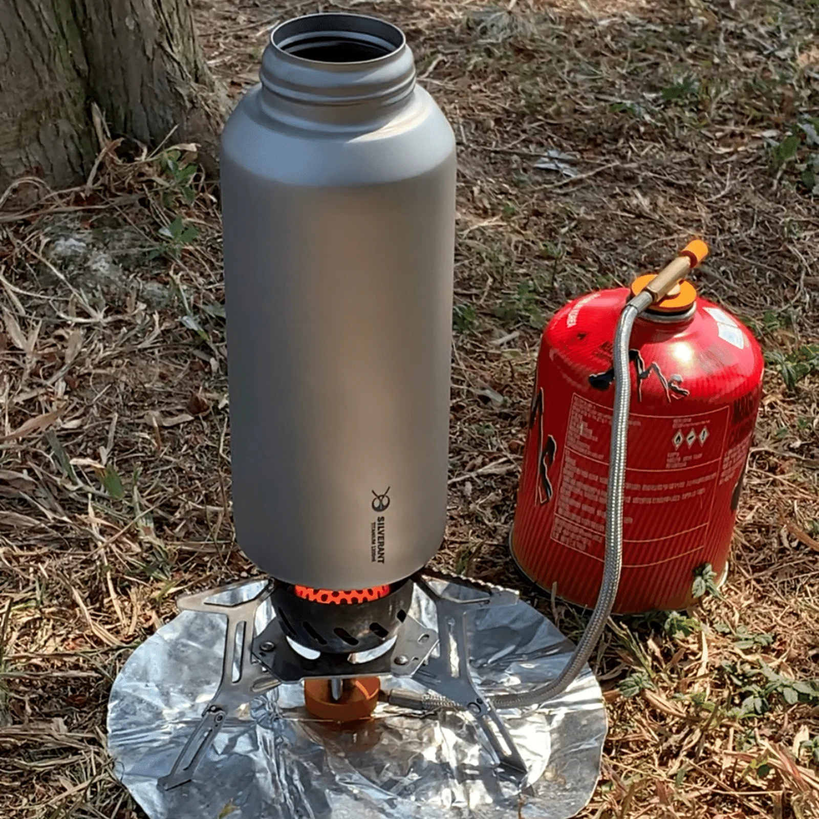 Titanium water bottle boiling water on camp stove outdoor - single wall Ti bottle direct flame use