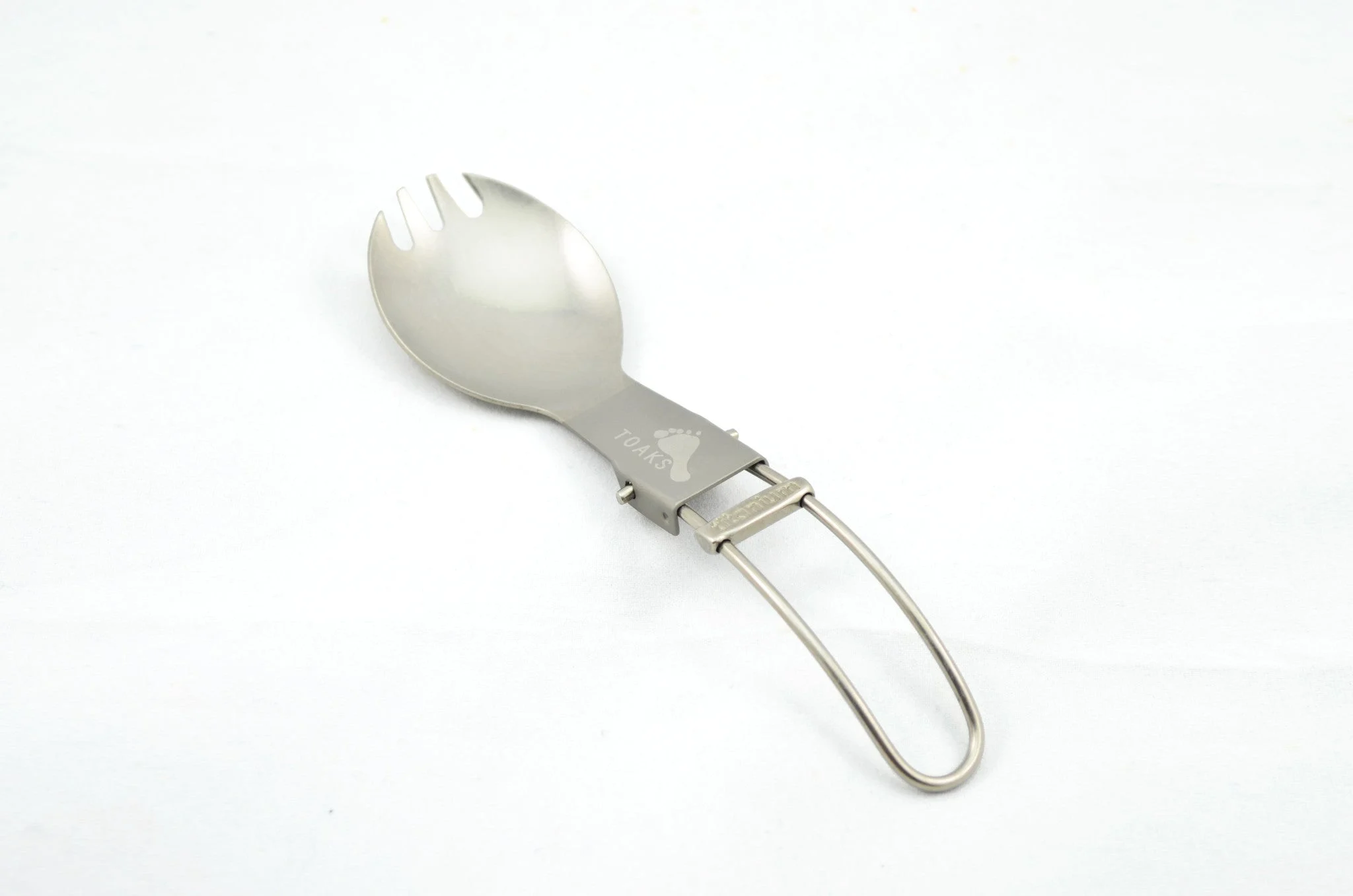 TOAKS SLV-06 titanium folding spork shown in folded and unfolded position - 18g sliding block lock mechanism TOAKS SLV-06 titanium folding spork shown in folded and unfolded position - 18g sliding block lock mechanism